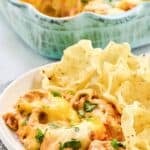 Cheesy Texas trash dip served with tortilla chips.