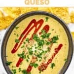 Copycat Torchy's green chile queso topped with hot sauce, cotija cheese, and cilantro.