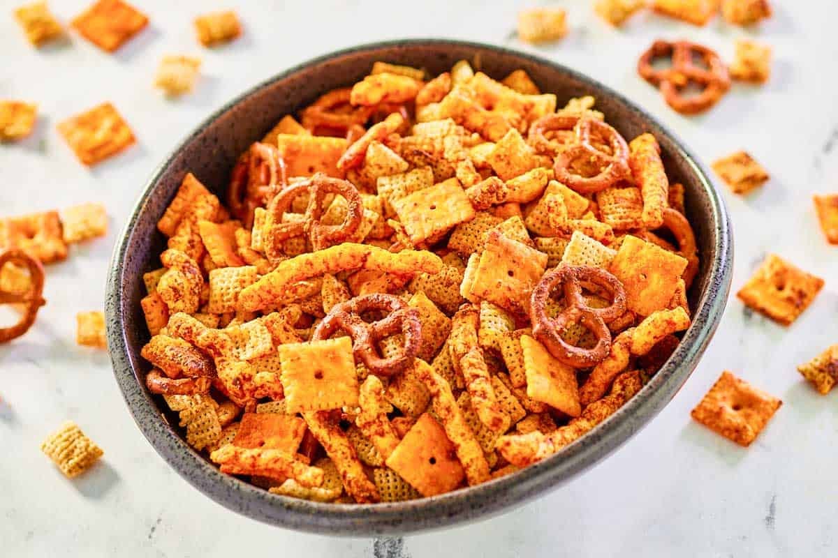 A bowl of cheesy snack mix.