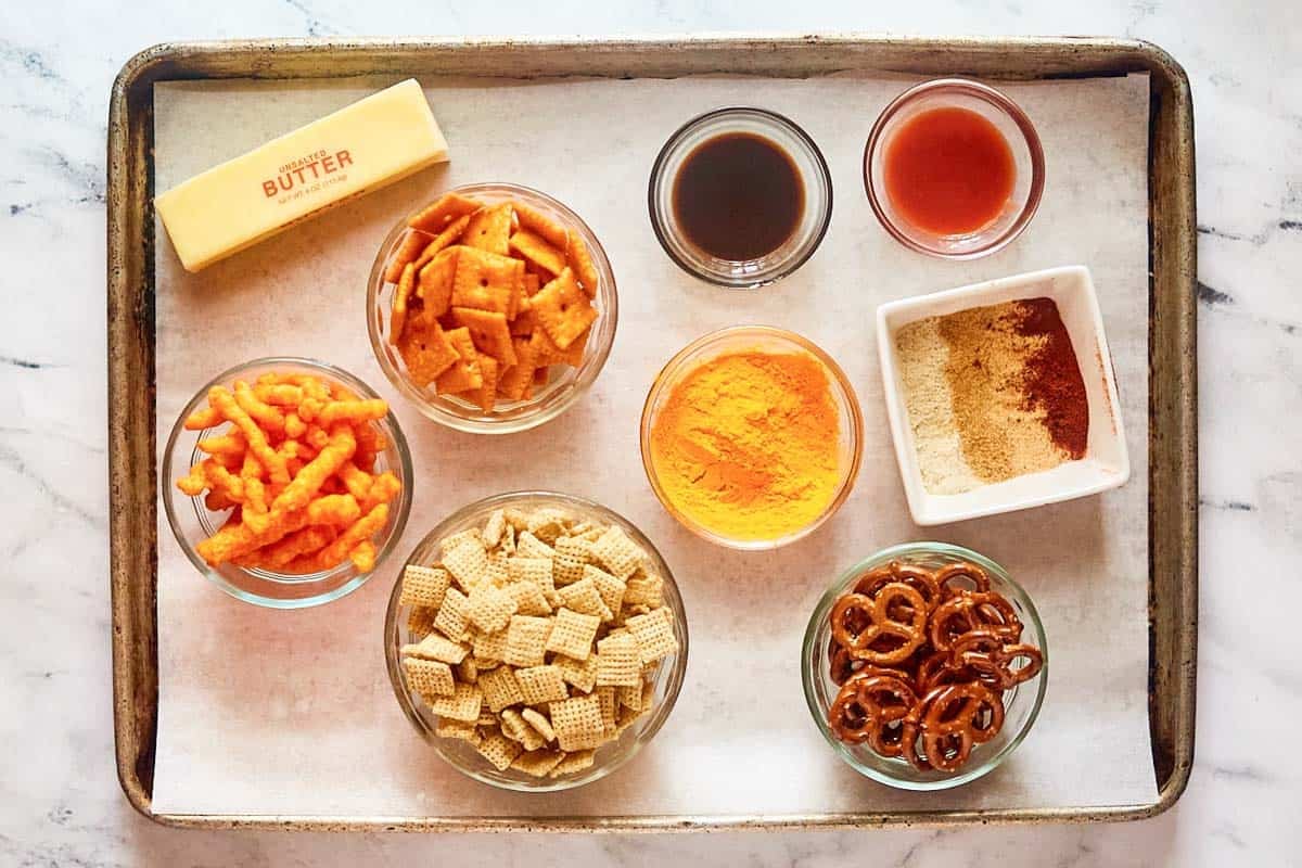 Chex cereal, pretzels, Cheetos, Cheez-its, butter, and seasonings.
