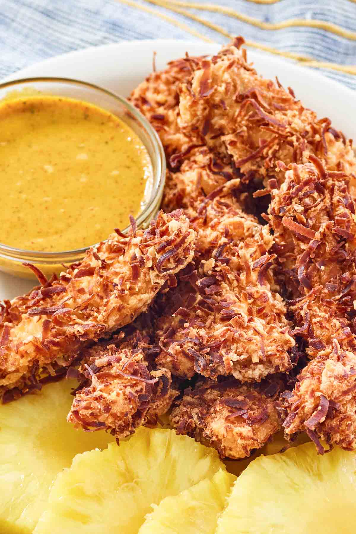 Coconut fried chicken tenders, pineapple, and honey mustard sauce.