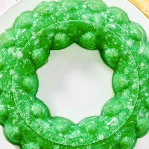 A lime gelatin salad with cottage cheese and pineapple.