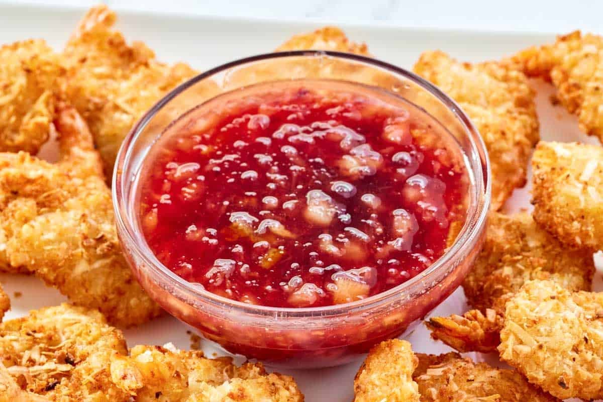 Plum pineapple dipping sauce served with fried shrimp.