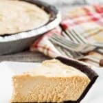 Copycat Afternoon Delight peanut butter pie slice on a plate in front of the pie.