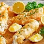 Copycat Captain D's battered fish filets and lemon wedges.