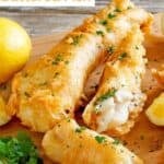 Copycat Captain D's battered fish and lemon wedges.