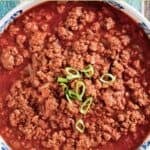 Copycat Chili's original chili garnished with green onions.