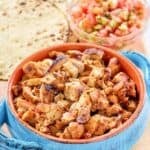 Copycat Chipotle chicken al pastor served with pico de gallo and tortillas.