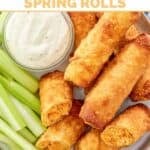 Copycat Grand Lux Cafe Buffalo chicken spring rolls, blue cheese dressing, and celery sticks.