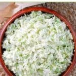 Homemade coleslaw in a small wooden bowl.