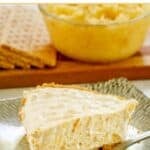 A slice of million dollar pineapple pie and a fork on a plate.