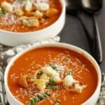 Copycat Panera creamy tomato soup garnished with croutons.