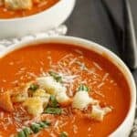 A bowl of copycat Panera tomato soup topped with croutons.
