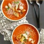 Copycat Panera tomato soup garnished with croutons.