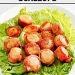 Copycat Red Lobster bacon-wrapped scallops over lettuce leaves on a platter.