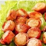 Copycat Red Lobster bacon-wrapped scallops served on lettuce leaves.