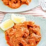 Copycat Red Lobster Cajun shrimp served with lemon wedges.