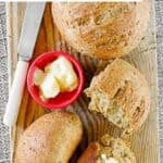 Copycat Saltgrass Steakhouse shiner bock beer bread loaves on a wooden cutting board.