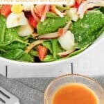 Homemade spinach salad tossed with hot bacon dressing.