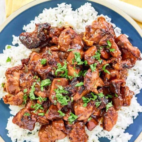 Brown sugar bourbon sauce chicken thigh pieces served over rice.
