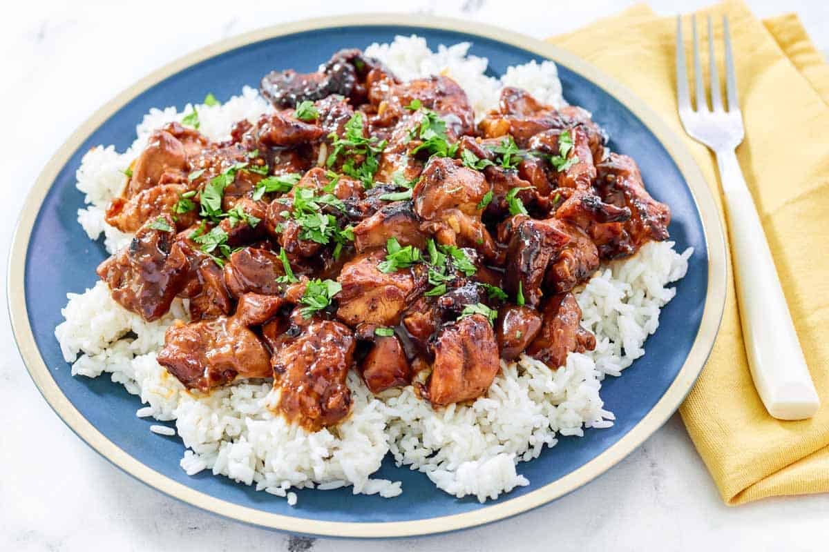 Chicken with brown sugar bourbon sauce served over white rice.