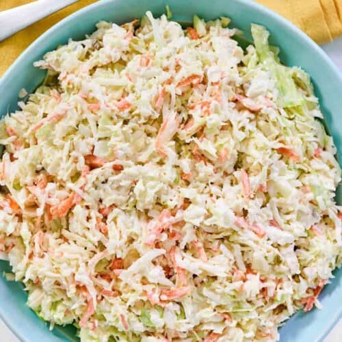 Creamy and tangy cabbage, carrot, onion, and pickle relish slaw.