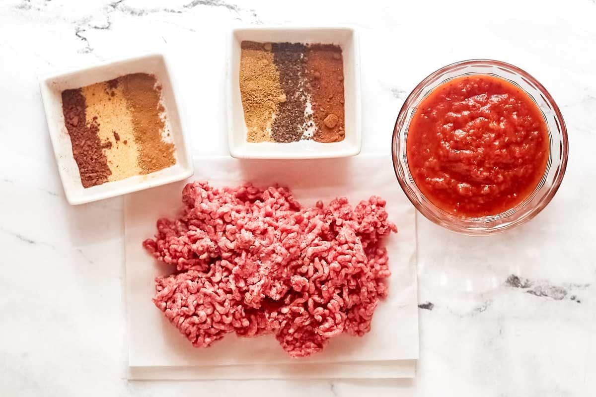 Ground beef, tomato sauce, and seasonings.