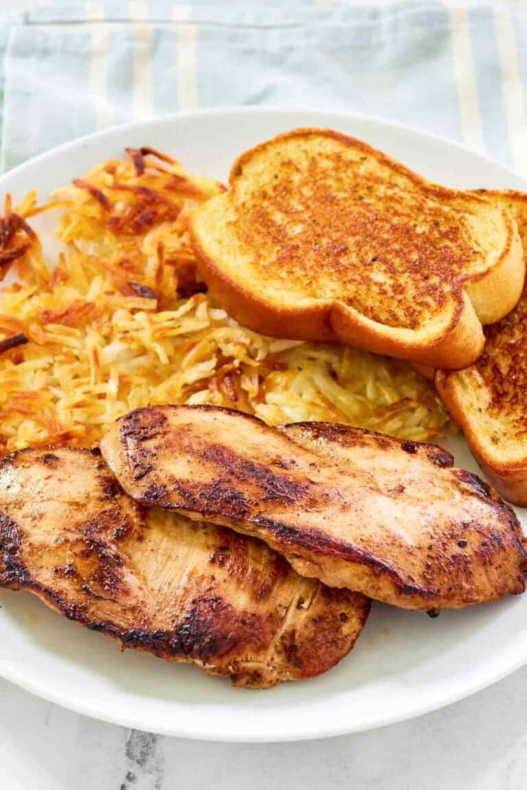 Marinated and grilled chicken served with hashbrowns and toast.