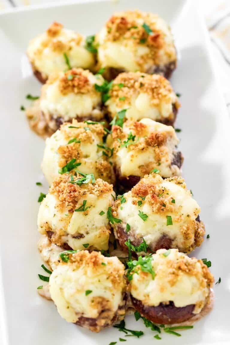 Baked mushrooms with cheesy stuffing, crunchy breadcrumb topping, and Alfredo sauce.