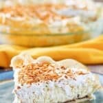 Copycat Bakers Square coconut cream pie with a black bottom and whipped cream topping.