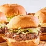 Big Mac sliders with homemade special sauce, lettuce, pickles, onions, and cheese.