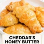A plate of copycat Cheddar's honey butter croissants.