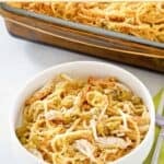 Chicken tetrazzini made with mushroom soup in a baking dish and a bowl.