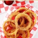 A parchment paper lined basket of copycat Dairy Queen onion rings.