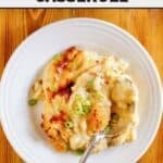 A serving of copycat Dickey's baked potato casserole and a spoon on a plate.