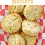 Copycat KFC buttermilk biscuits in a basket lined with parchment paper.