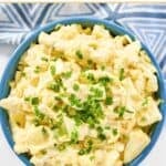 Copycat Kenny & Ziggy's egg salad garnished with chives.