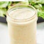 A mason jar filled with copycat Olive Garden salad dressing.