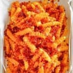 Copycat Outback Steakhouse Aussie cheese fries with bacon on a platter.