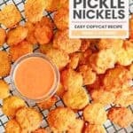 Copycat Red Robin pickle nickels and a cup of dipping sauce on a platter.