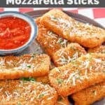 Copycat TGI Friday's crispy fried mozzarella cheese sticks served with marinara.