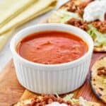 Copycat Taco Bell fire sauce in a condiment cup.