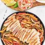 Shredded cheese, sour cream, pico de gallo, tortillas, grilled chicken slices, and grilled veggies.