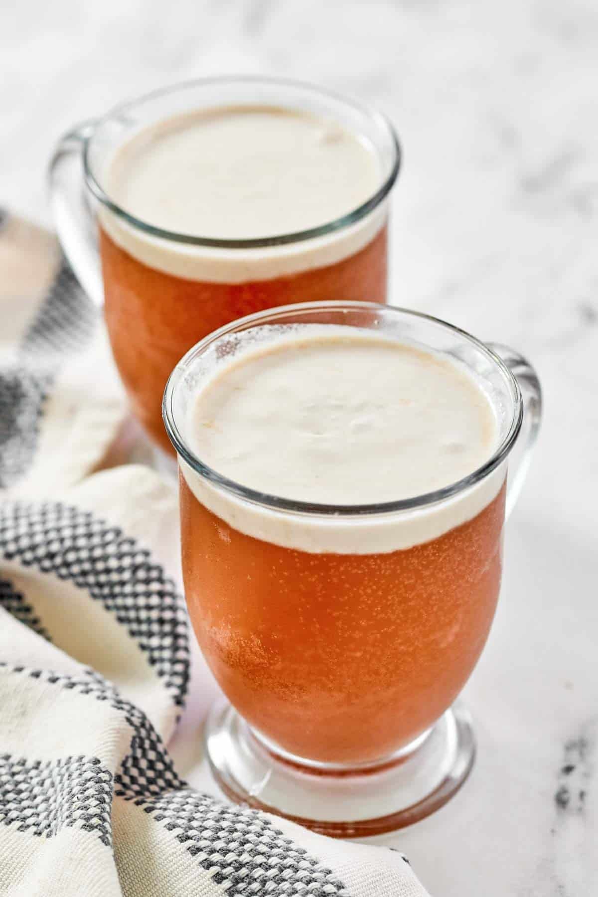 Coconut foam topped butterscotch soda drinks.