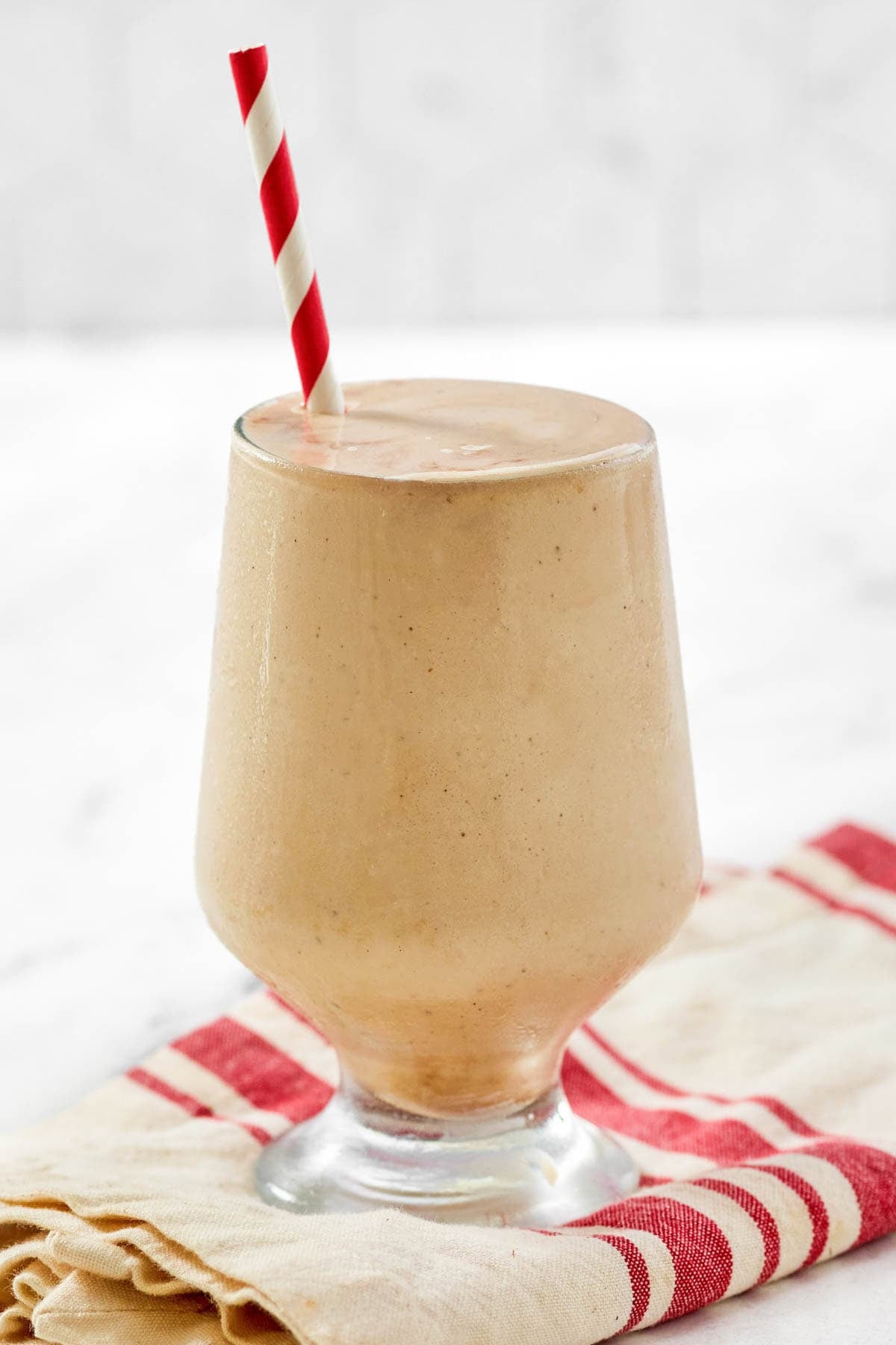 A coffee chocolate milkshake on a kitchen towel.