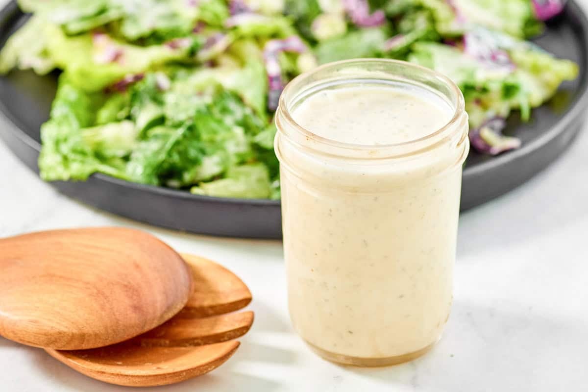 Creamy Italian restaurant-style salad dressing in a mason jar.