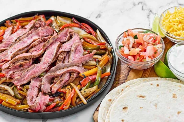 Grilled steak, bell peppers, and onions served with tortillas, pico de gallo, cheese, and sour cream.