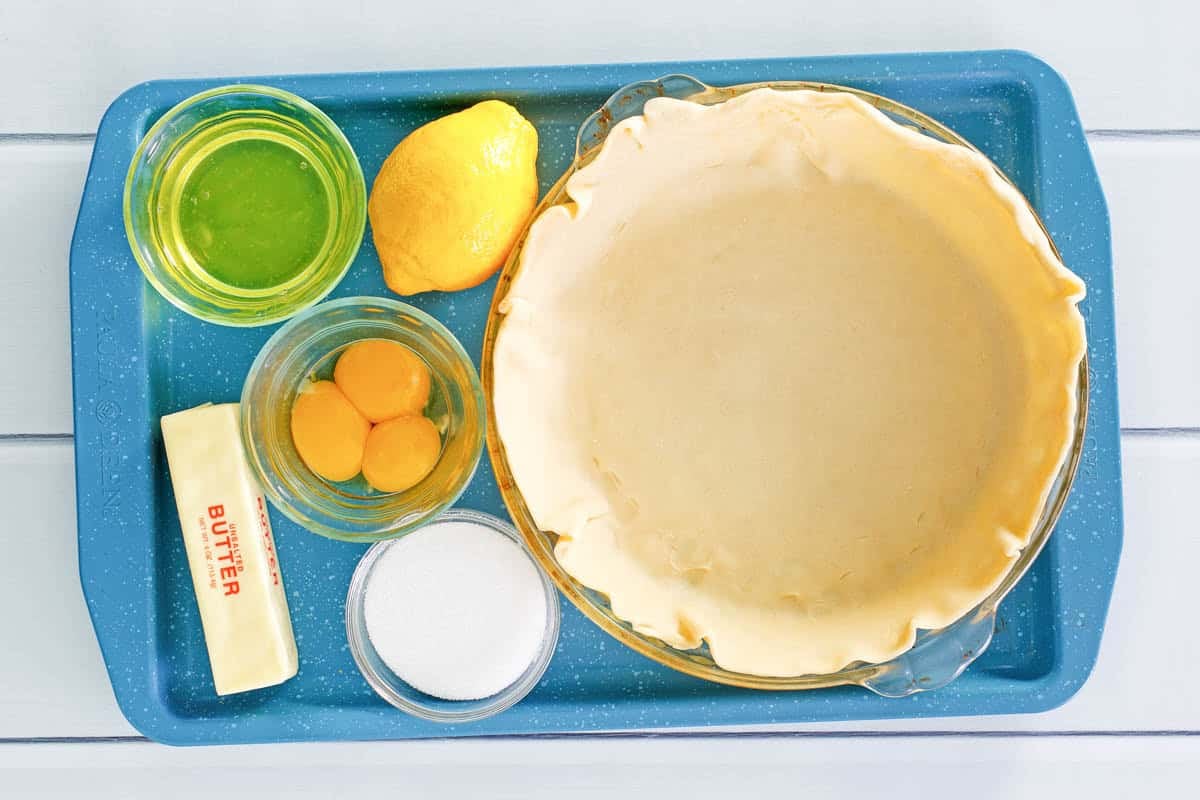 Lemon, lemon juice, eggs, butter, sugar, and pie crust.