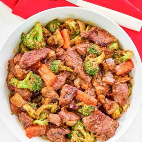 Stir fry with steak, vegetables, and black pepper sauce.