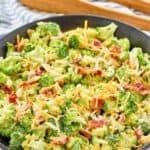 Copycat Chicken Salad Chick broccoli salad in a bowl and salad tongs behind it.